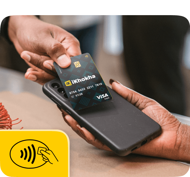 Tapping card on the back of a mobile phone in shop